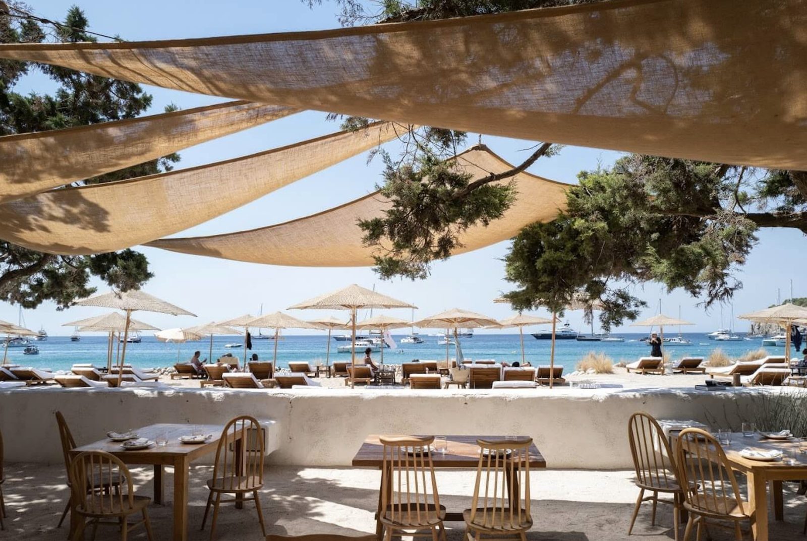 Chiringuito de Jondal — beach restaurant with linen canopies and sea view